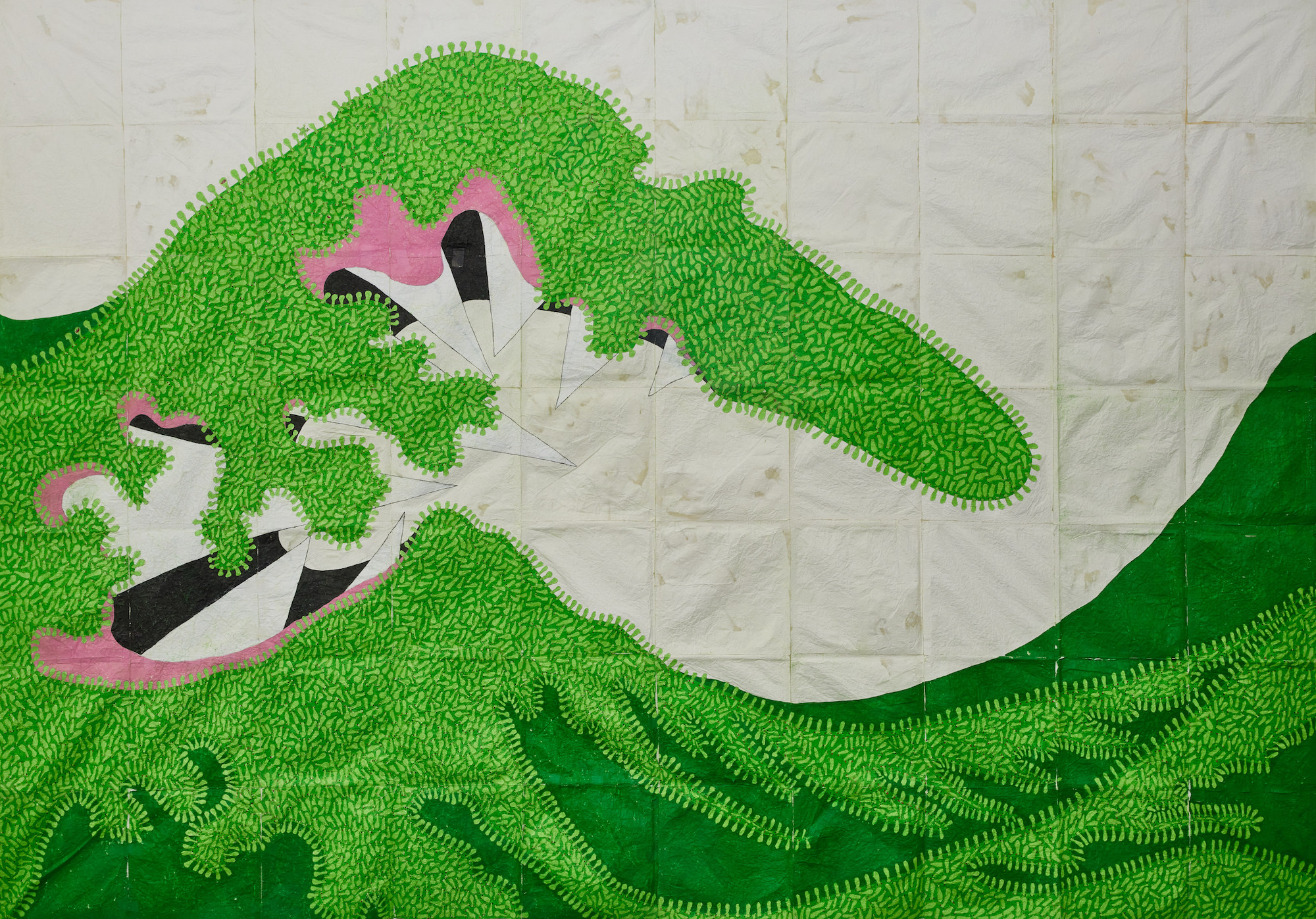 textile work of large green wave reflecting themes of pandemic